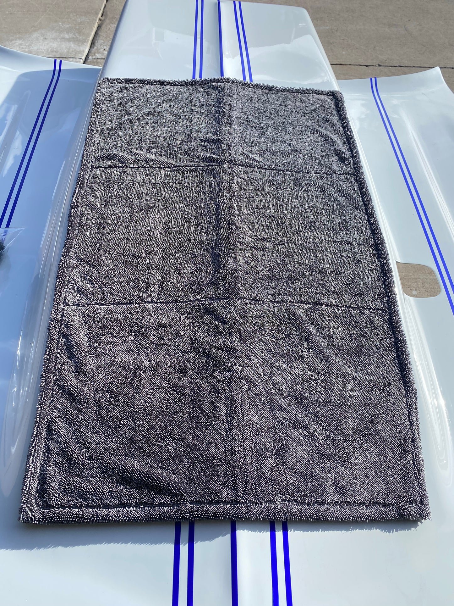 the finisher drying towel by casey performance on the hood of a 72 camaro